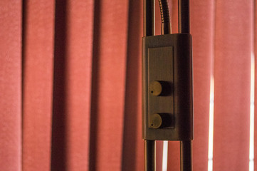 Lamps light switch in front of blinds