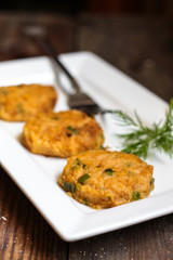Cutlets from beans, chickpeas and peas with greens in a white plate on the table (lean, vegetarian dish)