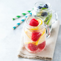Lemon lime berries fresh infused water detox drink cocktail lemonade