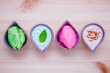 Alternative skin care and homemade scrubs lavender scrubs ,strawberry scrubs ,avocado scrubs and almond scrubs on wooden table.