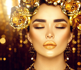 Golden holiday makeup. Golden wreath and necklace. Fashion art hairstyle and makeup