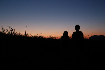 Fototapeta na wymiar young couple silhouette mountain