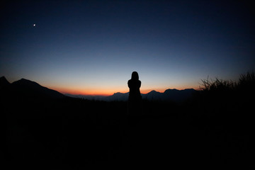 sunset silhouette, young lady in hill