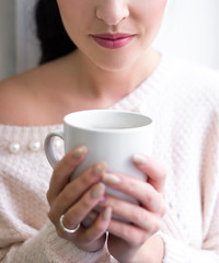 cup of coffee in female hands