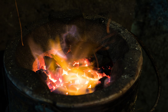 Flame in old charcoal stove.