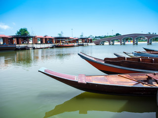 Fototapeta na wymiar Wooden boat float in lake