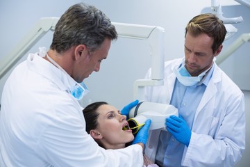 Obraz premium Dentists taking x-ray of patients teeth