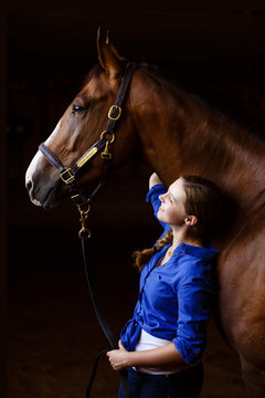 Smiling Girl Standing With A Warmblood Horse