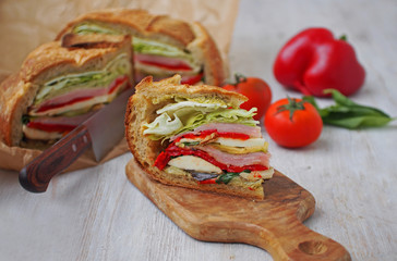 Mediterranean Pressed Picnic Sandwich with mozarella, grilled vegetables and ham