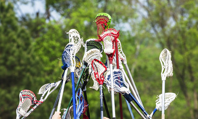 Lacrosse sticks held up together in team spirit