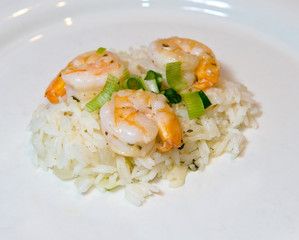 Shrimp scampi on rice with a shallow depth of field