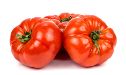 Three tomatoes on white