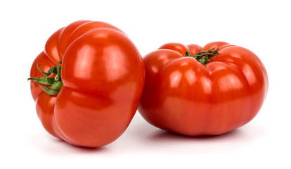 Two tomatoes on white