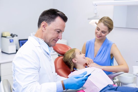 Dentist using digital tablet