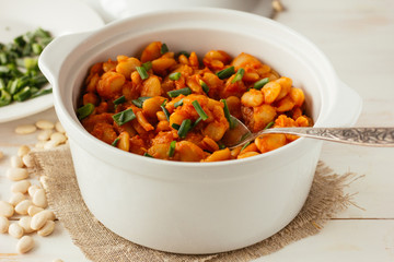 Baked lima beans in white pot