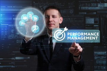 Business, Technology, Internet and network concept. Young businessman working on a virtual screen of the future and sees the inscription: Performance management
