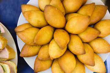 Small pies lie on a plate