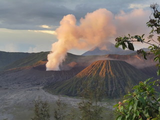 The sun reflects on the volcano