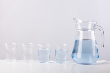 glass jug with water isolated on white background