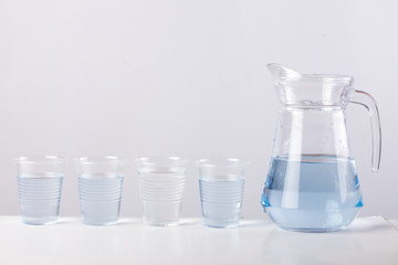 glass jug with water isolated on white background