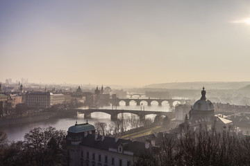 Prague town and river vitava in golden evening haze Praha travel czech republic