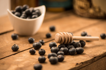 Blueberry Honey with blueberries and liquid honey in jar