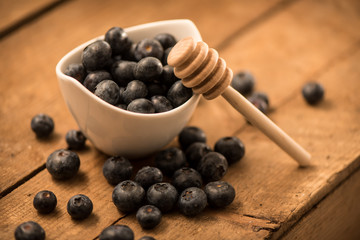 Blueberry Honey with blueberries and liquid honey in jar