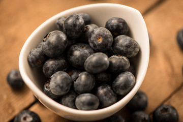 Blueberry Honey with blueberries and liquid honey in jar