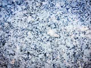 Macro closeup of granite stone rock abstract surface grained background