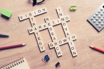 Conceptual business keywords on table with elements of game maki