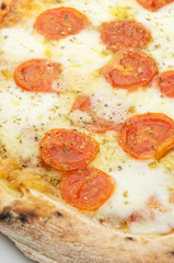 Pizza with fresh tomatoes and mozzarella closeup