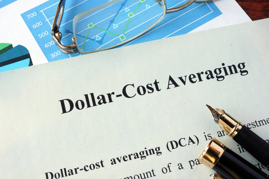 Dollar-cost averaging (DCA) on a paper and charts.