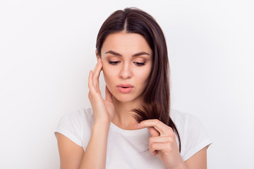 Close up portrait of young woman troubled about her hair  because of splitting ends