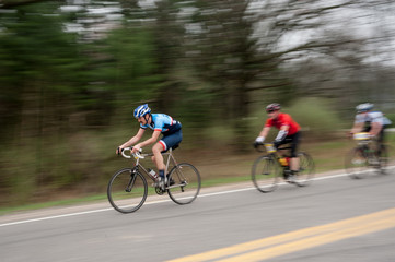 Two bike racers blurred