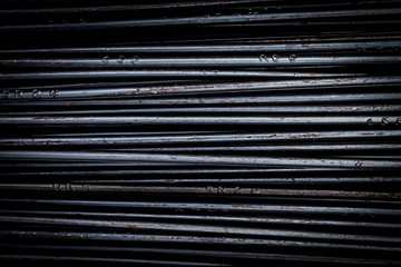 close up steel bar or steel reinforcement bar in the construction site, steel rods bars can use for reinforce concrete. construction background and texture.