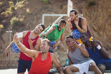 Naklejka premium Basketball players taking a selfie