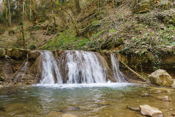Fototapeta premium Waterfall mountain river in the vicinity of the town of Goryachiy Klyuch