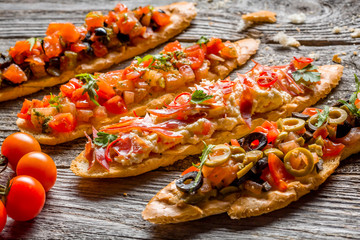 Bruschetta, toasted Italian bread with fresh vegetables.