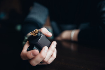 Fototapeta premium vaping man holding a mod. concept of refusal of tobacco. Vaping