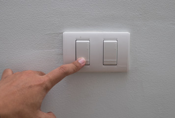 Press the light switch next to the wall.
