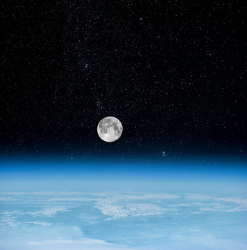View of Moonset. Moon and the earth's atmosphere view from space (Elements of this image furnished by NASA)