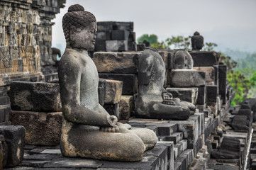 Fototapeta na wymiar Buddha statues in Borobudur Temple, Indonesia