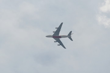 Fototapeta na wymiar airplane flying on sky in sunshine day