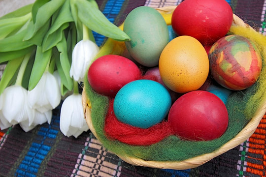     Close up of colorful painted easter eggs in a basket 