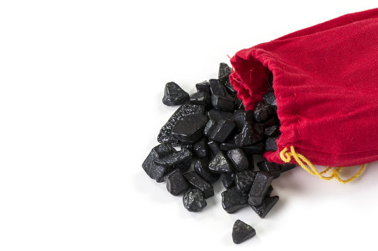 Red bag of coal isolated on white