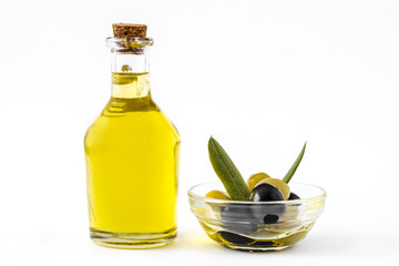 Virgin olive oil in a crystal bottle isolated on white background
