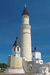 Fototapeta na wymiar Minaret and belltowers of Church of Assumption. Bulgar, Russia