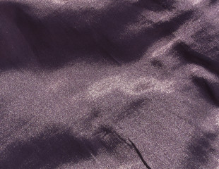 Purple color textile surface.