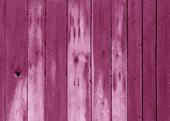 Wet pink color wooden fence pattern.