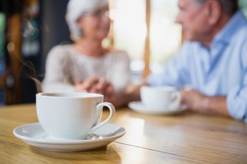 Close-up of coffee cup on table